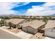 Scenic aerial view featuring the home, a palm tree, the surrounding neighborhood, and mountain backdrop at 7241 W Donner Dr, Laveen, AZ 85339