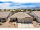Expansive aerial view showcasing the home's well-maintained exterior and the surrounding neighborhood at 7241 W Donner Dr, Laveen, AZ 85339