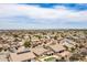 Panoramic aerial view of neighborhood homes in a well-maintained residential community under a bright sky at 7241 W Donner Dr, Laveen, AZ 85339
