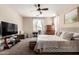 Bright bedroom with large window, ceiling fan, and dresser at 7241 W Donner Dr, Laveen, AZ 85339