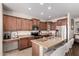 Spacious kitchen featuring granite countertops, stainless appliances, and wooden cabinets at 7241 W Donner Dr, Laveen, AZ 85339