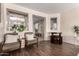 Cozy living room with hardwood floors, comfortable seating, and an open layout at 7241 W Donner Dr, Laveen, AZ 85339