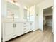 Bathroom featuring double vanity, modern fixtures, and walk-in closet at 733 E Megan Dr, San Tan Valley, AZ 85140