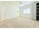 Bright bedroom with carpet floors, a large window, and a spacious closet at 733 E Megan Dr, San Tan Valley, AZ 85140