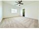 Inviting bedroom featuring plush carpet and a large window at 733 E Megan Dr, San Tan Valley, AZ 85140