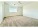 Cozy bedroom with soft carpet, a bright window and a ceiling fan at 733 E Megan Dr, San Tan Valley, AZ 85140