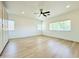 A spacious bedroom featuring wood floors, built-in closet, and lots of natural light at 733 E Megan Dr, San Tan Valley, AZ 85140