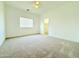 Spacious bedroom featuring plush carpet, natural light, and a walk-in closet at 733 E Megan Dr, San Tan Valley, AZ 85140