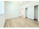 Bedroom with wood flooring, window, and a closet at 733 E Megan Dr, San Tan Valley, AZ 85140
