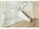 Foyer featuring tile flooring, stairs, and a window at 733 E Megan Dr, San Tan Valley, AZ 85140