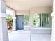 Inviting covered front porch with a blue front door and neutral paint at 733 E Megan Dr, San Tan Valley, AZ 85140