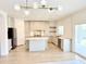 Bright kitchen features a large island, stainless steel appliances, and modern lighting at 733 E Megan Dr, San Tan Valley, AZ 85140