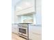 Stainless steel stovetop and oven with white cabinetry and modern countertops at 733 E Megan Dr, San Tan Valley, AZ 85140
