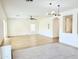 Spacious living room with modern lighting, and large windows for natural light at 733 E Megan Dr, San Tan Valley, AZ 85140