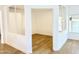 Bright home office space with white walls and wood flooring at 733 E Megan Dr, San Tan Valley, AZ 85140