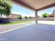 Covered patio with concrete slab, gravel features, and a view of the block wall at 733 E Megan Dr, San Tan Valley, AZ 85140