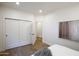 Bright bedroom features a closet, paneled doors, and an open doorway that brings in natural light at 7348 N 9Th Pl, Phoenix, AZ 85020
