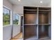 Spacious gray walk-in closet with custom shelving and a floor length mirror for accessories at 7348 N 9Th Pl, Phoenix, AZ 85020
