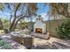 The outdoor fireplace is the focal point of this lovely backyard space at 7348 N 9Th Pl, Phoenix, AZ 85020