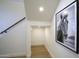 Bright hallway features a staircase, and artwork of a horse at 7348 N 9Th Pl, Phoenix, AZ 85020