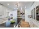 Bright and spacious kitchen with island seating and a view into the living room at 7348 N 9Th Pl, Phoenix, AZ 85020