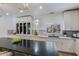 Bright kitchen features white cabinetry, marble countertops, and a large island with seating at 7348 N 9Th Pl, Phoenix, AZ 85020