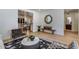 Open-concept living area with hardwood floors, modern decor, stylish furniture, and a view into the kitchen at 7348 N 9Th Pl, Phoenix, AZ 85020