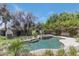 Beautiful backyard featuring a sparkling pool and lush landscaping at 7348 N 9Th Pl, Phoenix, AZ 85020