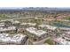 Aerial view featuring a complex near a lake and golf course offering serene living at 7601 E Indian Bend Rd # 3030, Scottsdale, AZ 85250