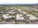 Aerial view of condo community near a golf course and lake offering resort-style living at 7601 E Indian Bend Rd # 3030, Scottsdale, AZ 85250