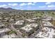 Aerial view featuring the community, lush landscaping, and nearby golf courses and lake at 7601 E Indian Bend Rd # 3030, Scottsdale, AZ 85250