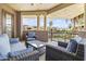Relaxing balcony featuring comfortable seating with scenic views of the community pool and palm trees at 7601 E Indian Bend Rd # 3030, Scottsdale, AZ 85250