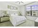 Bright bedroom features large window, ceiling fan, and coordinated art for a relaxing atmosphere at 7601 E Indian Bend Rd # 3030, Scottsdale, AZ 85250