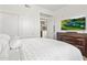 Bedroom featuring a large bed, TV, closet, and ample storage with contemporary decor at 7601 E Indian Bend Rd # 3030, Scottsdale, AZ 85250