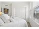 Bright bedroom with a comfortable bed, closet, and a view of the outside from the window at 7601 E Indian Bend Rd # 3030, Scottsdale, AZ 85250