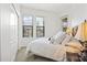 Bright bedroom featuring a comfortable bed, a closet, and three windows with neighborhood views at 7601 E Indian Bend Rd # 3030, Scottsdale, AZ 85250