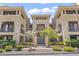 Exterior view of a building with manicured landscaping and decorative architectural features at 7601 E Indian Bend Rd # 3030, Scottsdale, AZ 85250