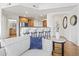 View of the kitchen with stainless steel appliances and breakfast bar from the comfort of the living room at 7601 E Indian Bend Rd # 3030, Scottsdale, AZ 85250
