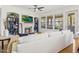 Comfortable living room with golf course view, stone fireplace, and modern ceiling fan providing cozy ambiance at 7601 E Indian Bend Rd # 3030, Scottsdale, AZ 85250