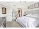 Inviting main bedroom featuring a comfortable bed, elegant decor, and large mirror at 7601 E Indian Bend Rd # 3030, Scottsdale, AZ 85250