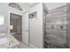Elegant bathroom with a granite countertop vanity, gray tile flooring, and walk-in shower with gray tiled walls at 7949 W Wescott Dr, Glendale, AZ 85308