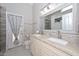 Bathroom features double sink vanity, granite countertops, and walk-in shower at 7949 W Wescott Dr, Glendale, AZ 85308
