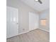 Neutral bedroom with white trim, wood flooring, a ceiling fan, closet, and window at 7949 W Wescott Dr, Glendale, AZ 85308