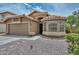 Delightful single-Gathering home showcases a two-car garage, xeriscaping, and a charming window, all contributing to a warm, welcoming feel at 7949 W Wescott Dr, Glendale, AZ 85308