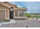 Inviting single-Gathering home features desert-friendly landscaping, a secured front entry, and a sunny bay window, enhancing its charm at 7949 W Wescott Dr, Glendale, AZ 85308
