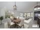 Bright living space featuring an open-concept design with a dining area, modern decor, and plenty of natural light at 7949 W Wescott Dr, Glendale, AZ 85308