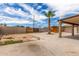 The backyard includes a palm tree, block fence, and a partly-covered patio at 8542 N 30Th Dr, Phoenix, AZ 85051