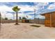 The backyard features a palm tree and a large patio area, great for outdoor gatherings at 8542 N 30Th Dr, Phoenix, AZ 85051