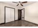 A bright bedroom with wood-look flooring and closet, ready for comfort and relaxation at 8542 N 30Th Dr, Phoenix, AZ 85051