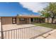 View of the home showcasing the covered parking, gated yard, and well-maintained lawn at 8542 N 30Th Dr, Phoenix, AZ 85051